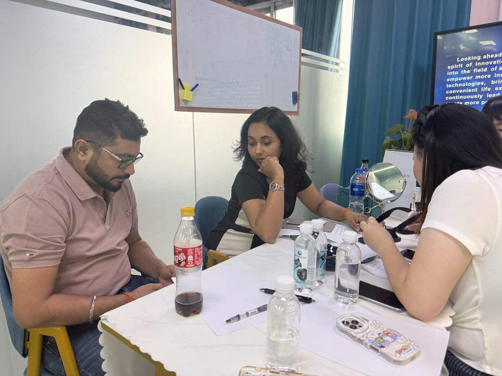 Nitasha and Mohit discussing smart glasses products with the Altevo team